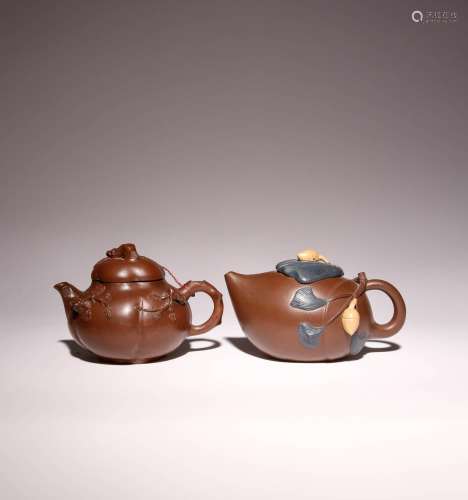 TWO CHINESE YIXING TEAPOTS AND COVERS 20TH CENTURY One decor...