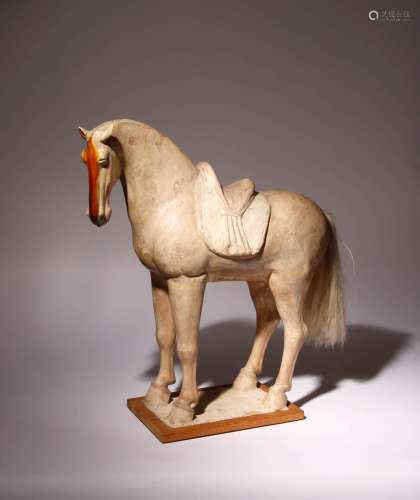 A LARGE CHINESE POTTERY MODEL OF A HORSE TANG DYNASTY Standi...