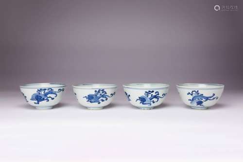 A SET OF FOUR CHINESE BLUE AND WHITE `KUI DRAGON` BOWLS LATE...