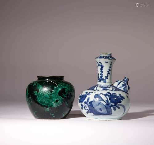 A CHINESE BLUE AND WHITE KENDI AND A GREEN AND BLACK-ENAMELL...