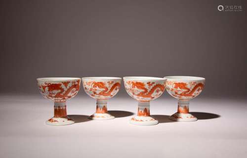 FOUR CHINESE IRON-RED `DRAGON` STEM CUPS LATE QING DYNASTY E...