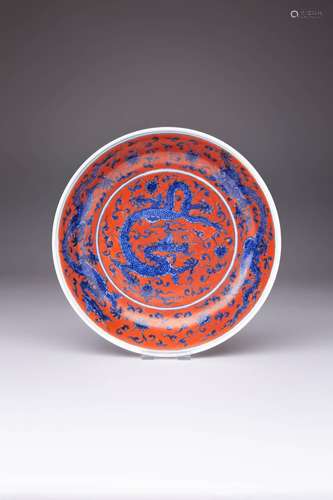 A CHINESE UNDERGLAZE BLUE AND IRON-RED DECORATED `DRAGON` DI...