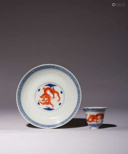 A CHINESE UNDERGLAZE BLUE AND IRON-RED `DRAGON` SAUCER AND W...