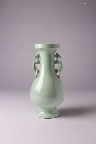 A CHINESE CELADON ANHUA-DECORATED BALUSTER VASE LATE QING DY...