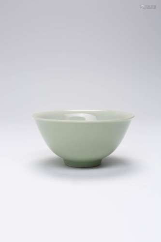 A CHINESE CELADON BOWL QING DYNASTY Raised on a short taperi...