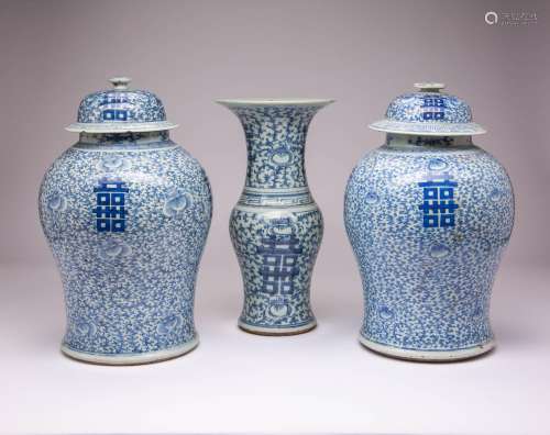 A NEAR PAIR OF CHINESE BLUE AND WHITE BALUSTER VASES AND COV...