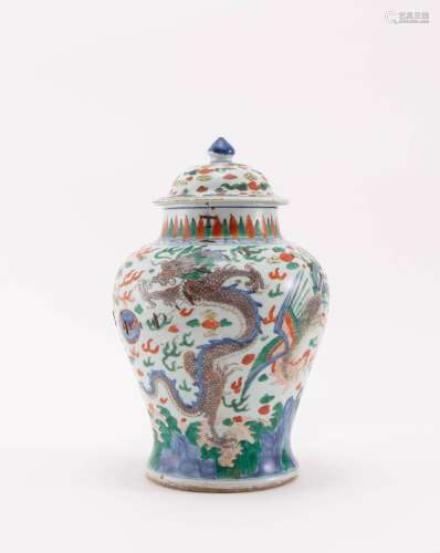 A CHINESE WUCAI `DRAGON AND PHOENIX` JAR AND COVER 17TH CENT...