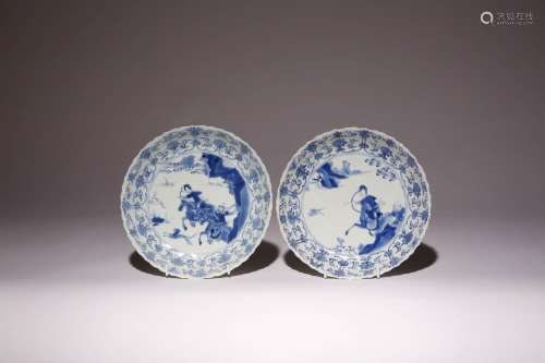 A PAIR OF CHINESE BLUE AND WHITE MOULDED `HUNTING` DISHES KA...