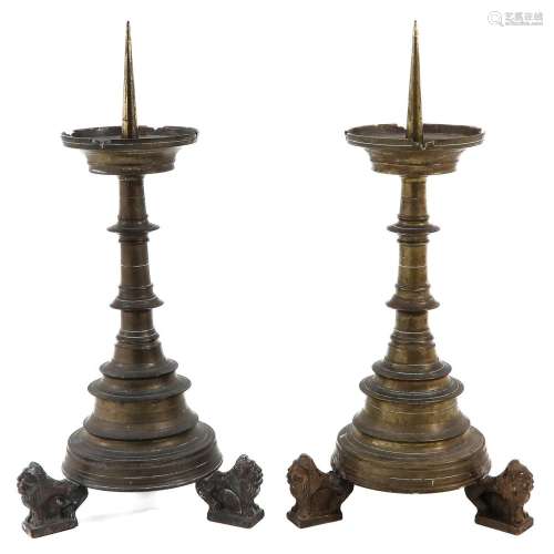 A Pair of Bronze Neo Gothic Pen Candlesticks