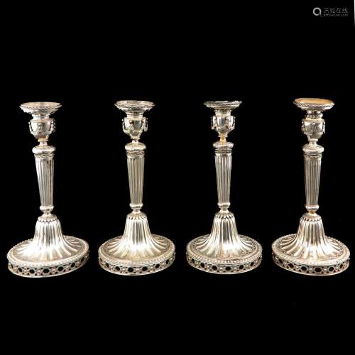 A Collection of 4 Silver Louis XVI Style Candlesticks