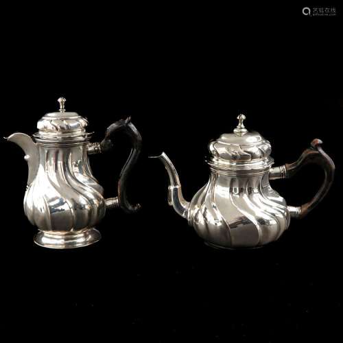 A Pair of 18th Century Silver Pitchers with Covers