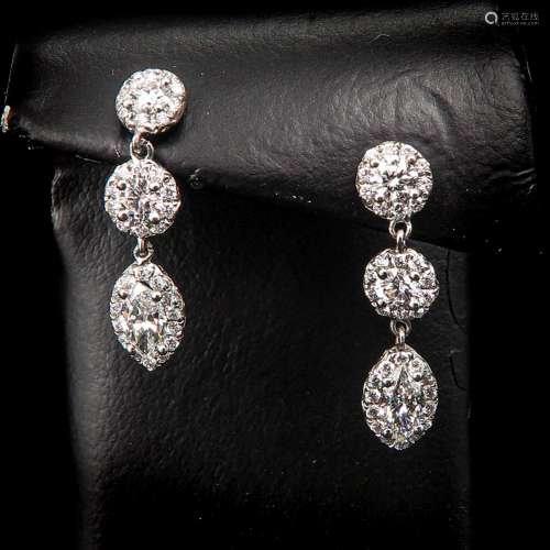 A Pair of 18KG Diamond Earrings.