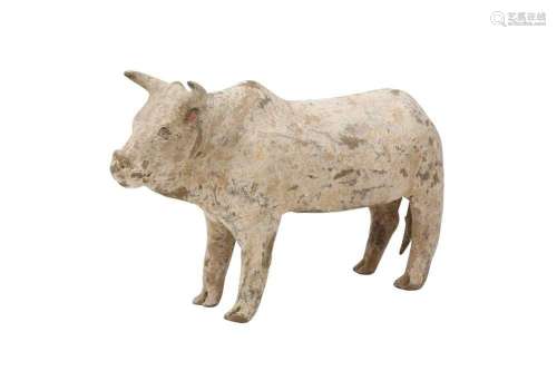A CHINESE POTTERY FIGURE OF A BULL