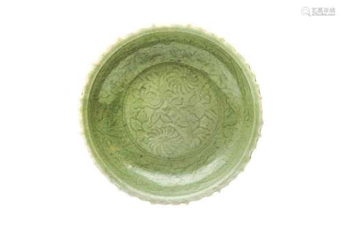 A CHINESE CELADON-GLAZED `BLOSSOMS` CHARGER