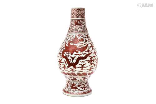 A LARGE CHINESE IRON RED-DECORATED `DRAGON AND PHOENIX` VASE