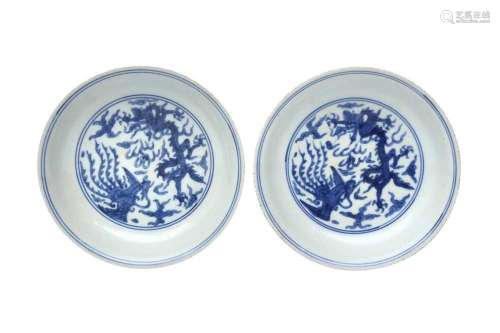A PAIR OF CHINESE BLUE AND WHITE `DRAGON AND PHOENIX` DISHES