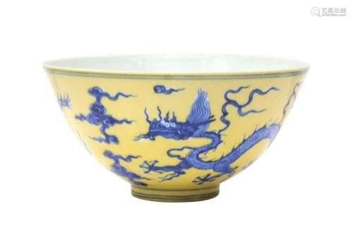 A CHINESE YELLOW-ENAMELLED BLUE AND WHITE `DRAGON` BOWL