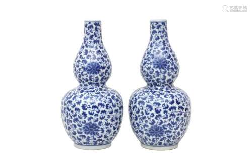 A PAIR OF CHINESE BLUE AND WHITE DOUBLE GOURD `LOTUS SCROLL`...