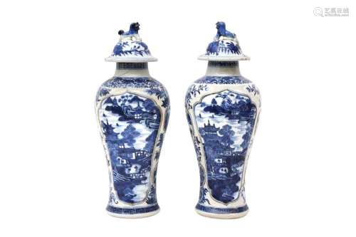 A PAIR OF CHINESE BLUE AND WHITE VASES AND COVERS