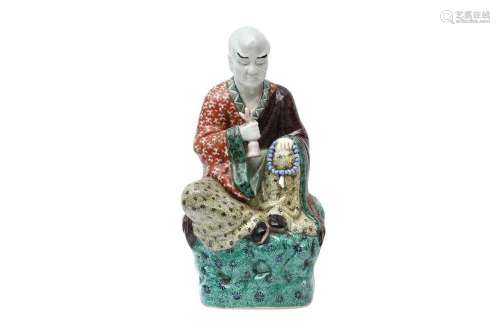 A CHINESE FAMILLE-VERTE FIGURE OF A LUOHAN