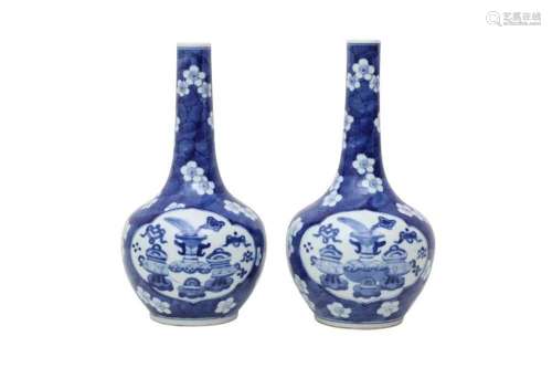 A PAIR OF CHINESE BLUE AND WHITE `TREASURES` BOTTLE VASES
