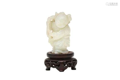 A CHINESE PALE CELADON JADE CARVING OF A BOY