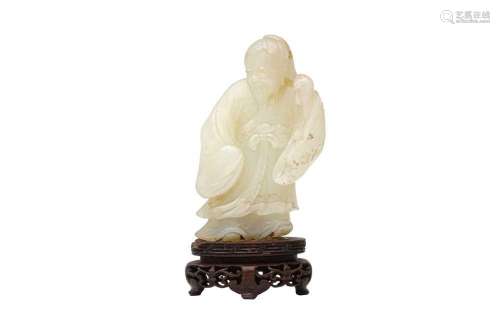 A CHINESE PALE CELADON JADE FIGURE OF A SAGE