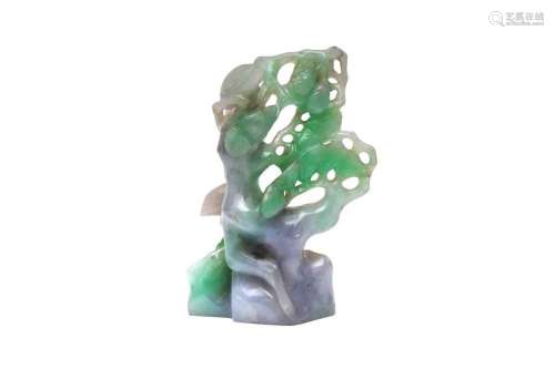 A CHINESE APPLE-GREEN JADEITE CARVING OF A PINE TREE