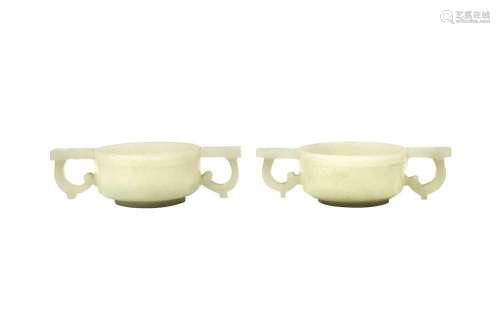 A PAIR OF CHINESE PALE CELADON HARDSTONE TWIN-HANDLED CUPS