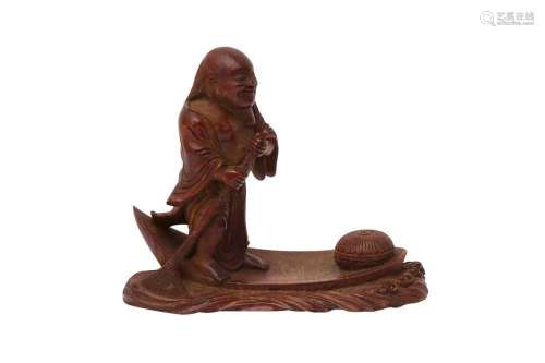 A CHINESE BAMBOO CARVING OF A SAGE ON A RAFT