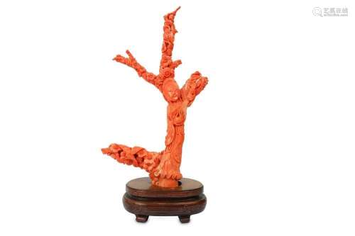 λ A CHINESE CORAL CARVING OF AN IMMORTAL MAIDEN