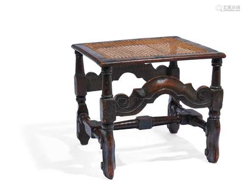 A CARVED OAK AND CANED STOOL, LATE 17TH CENTURY AND LATER