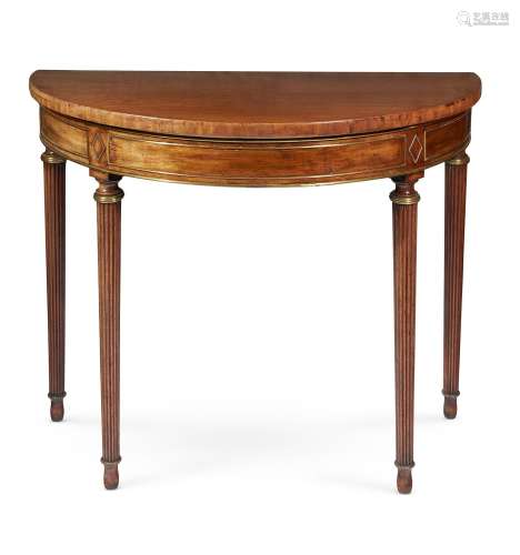A REGENCY MAHOGANY AND BRASS MOUNTED DEMI-LUNE SIDE OR CONSO...