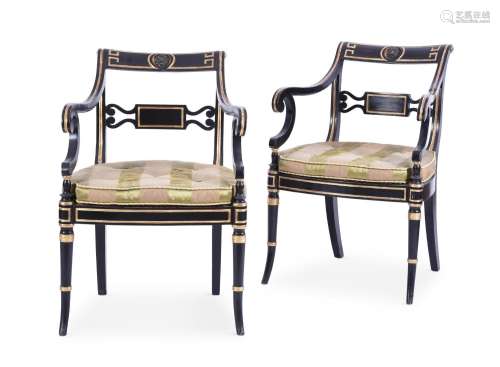 A PAIR OF REGENCY EBONISED AND PARCEL GILT OPEN ARMCHAIRS, I...