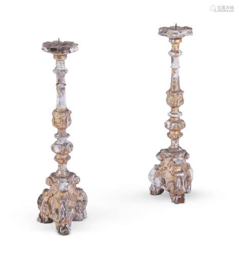 A PAIR OF ITALIAN CARVED GILTWOOD PRICKET STICKS, 18TH OR 19...