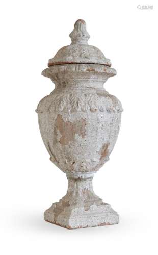 A TERRACOTTA AND CREAM PAINTED LIDDED VASE,  IN 18TH CENTURY...