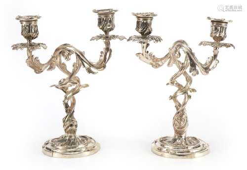 Pair of Rococo style silvered acanthus design two branch can...