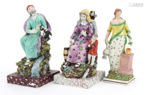 Three 19th century pearlware figures including one of a Grec...