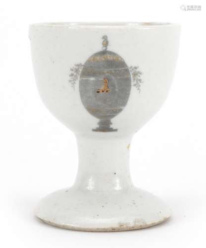 Chinese porcelain eggcup hand painted and gilded with an arm...