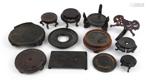 Collection of Antique and later Chinese hardwood stands, som...