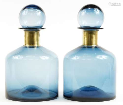 Pair of oversized blue glass display scent bottles with stop...