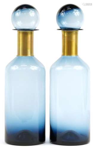 Pair of oversized blue glass display scent bottles with stop...