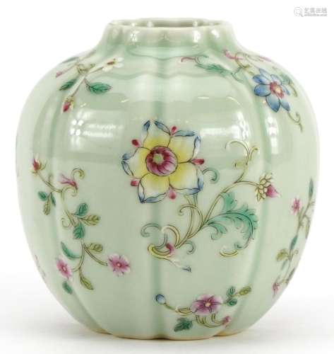 Chinese porcelain vase having a celadon glaze hand painted i...