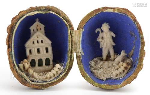 19th century European walnut diorama opening to reveal a she...