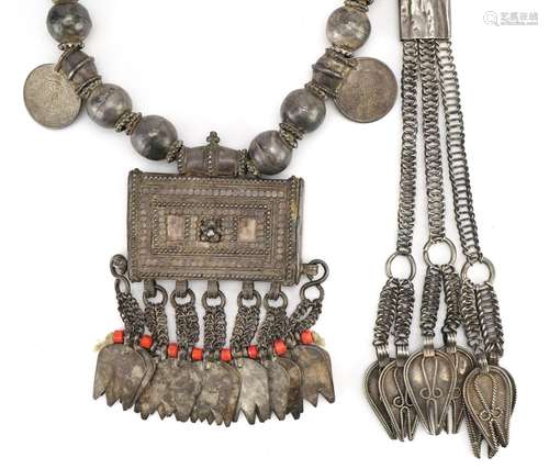 Omani unmarked silver amulet with coins, together with a sim...