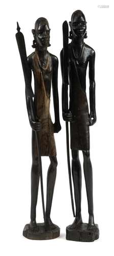 Large pair of African carved figures of tribes people holdin...