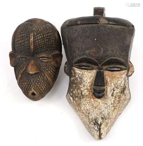 Two Tribal interest face masks including one with white pain...