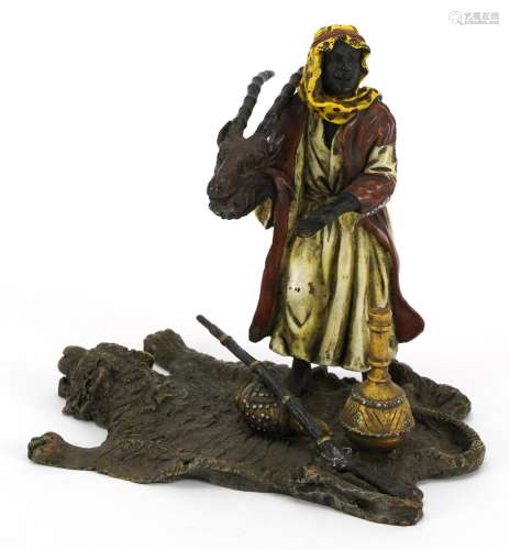 Modern cold painted bronze of an Arab holding an animal skul...