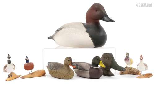 Eight hand painted wooden duck decoys and figures, some sign...