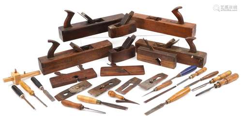 Collection of vintage woodworking planes and chisels, the la...